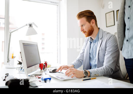 Coworkers planning startup goals in office Stock Photo