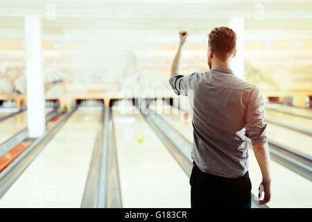 Conceptual image of a winner represented by male raising hand Stock Photo