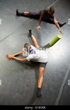 Dancers doing stretching exercise Stock Photo