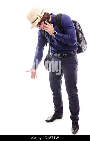 dissatisfied tourist talking on the phone on white background Stock Photo