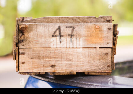 Wooden box fruit with numers in front Stock Photo