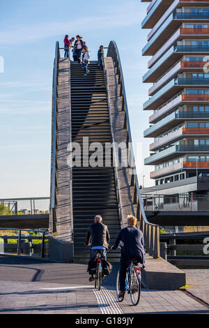 Cycle and pedestrian bridge, Melkwegbruk in Purmerend, North Holland, via a channel, arch bridge for pedestrians and cyclists Stock Photo