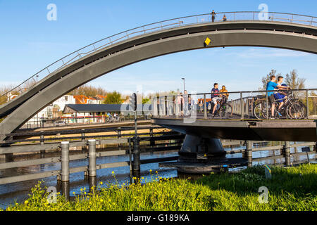 Cycle and pedestrian bridge, Melkwegbruk in Purmerend, North Holland, via a channel, arch bridge for pedestrians and cyclists Stock Photo