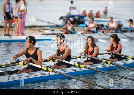 RIO DE JANEIRO - APRIL 2, 2016: A quadruple scull boat (with four rowers) competes in a race on Lagoa Rodrigo de Freitas lagoon. Stock Photo