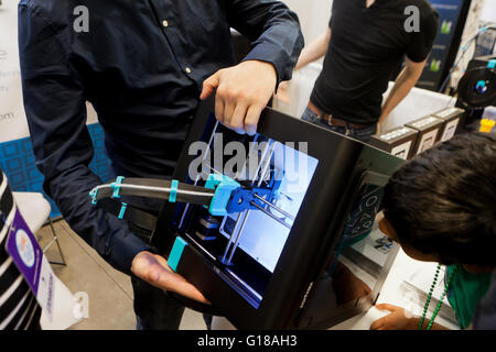 Man demonstrating a 3D printer - USA Stock Photo