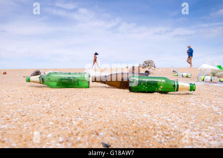 bottles and garbage waste on the beach Stock Photo
