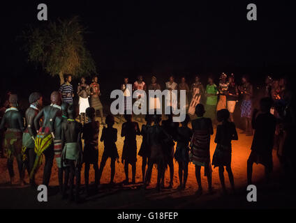 Hamer tribe people dancing at night, Omo valley, Turmi, Ethiopia Stock Photo
