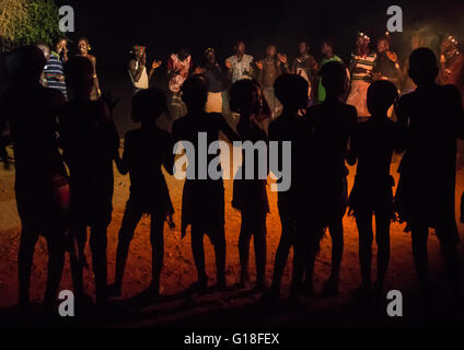 Hamer tribe people dancing at night, Omo valley, Turmi, Ethiopia Stock Photo