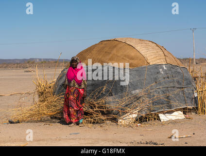 Afar tribe woman in front of her traditional hut, Afar region, Semera, Ethiopia Stock Photo