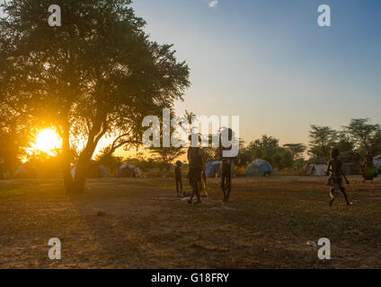 Dimi ceremony at sunset to celebrate circumcision of teenagers in dassanech tribe, Omo valley, Omorate, Ethiopia Stock Photo