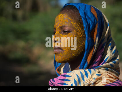 Afar tribe teenage girl with qasil on her face, Afar region, Afambo, Ethiopia Stock Photo