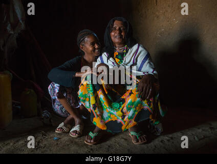 A karrayyu tribe girl called aliya who was the first girl educated in her tribe pausing with her mother, Oromia, Metehara, Ethio Stock Photo