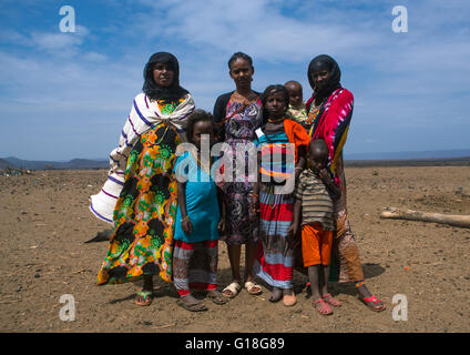 A karrayyu tribe girl called aliya who was the first girl educated in her tribe pausing with her family, Oromia, Metehara, Ethio Stock Photo