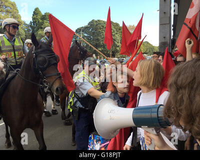 Police force student protestors off the road during a march against 2016 budget cuts. Stock Photo