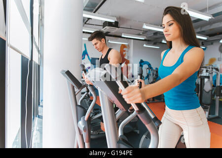 People exercising in gym to keep body in shape Stock Photo
