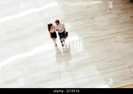 Business couple walking together. Top view Stock Photo