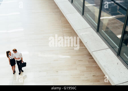 Business couple walking together. Top view Stock Photo