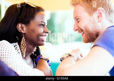 Romantic couple smiling while looking into each others eyes Stock Photo ...