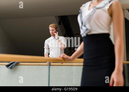 Businessman using phone while having a break Stock Photo