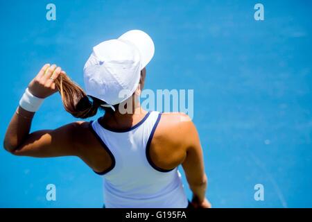 Female tennis player preparing to serve. Shot taken from above Stock Photo