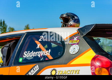 Emmaboda, Sweden - May 7, 2016: 41st South Swedish Rally in service depot. Helmet on top of a car in the sunshine. Stock Photo