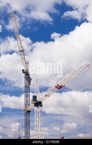 Two cranes work on a constuction site in Burlington Ont, on May 9, 2016. Stock Photo