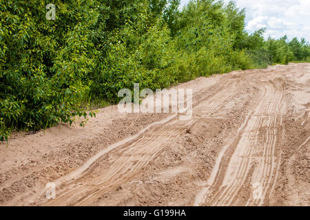 Abstract background - the wheel tracks in sand. Stock Photo