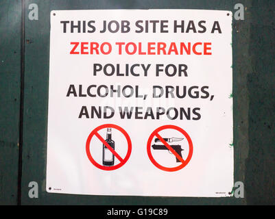 A sign at a construction site in New York informs workers of the company's zero tolerance for alcohol, drugs and weapons, seen on Sunday, May 8, 2016. (© Richard B. Levine) Stock Photo