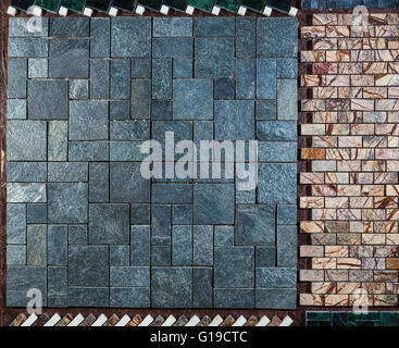 Marble wall or floor made of different types of tiles Stock Photo