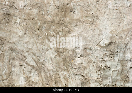 old gray cracked stucco wall background texture Stock Photo