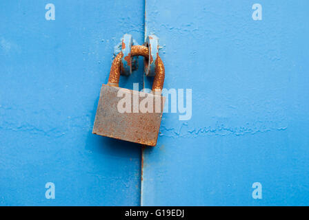 Old padlock on metal gate. Stock Photo