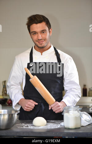 Chef preparing dough in a kitchen Pizza Stock Photo