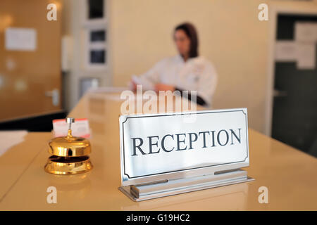 hotel reception desk with bell Stock Photo