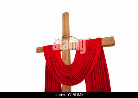 A wooden christian cross with a crown of thorns isolated on whit Stock Photo