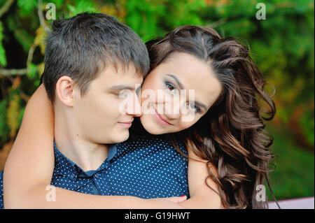 Young happy smiling attractive couple together outdoors Stock Photo