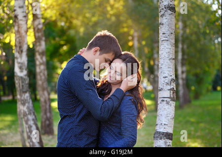 Close up portrait of attractive young couple in love outdoors. Stock Photo