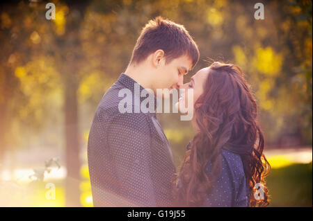 Young guy with a girl under the tree. Stock Photo