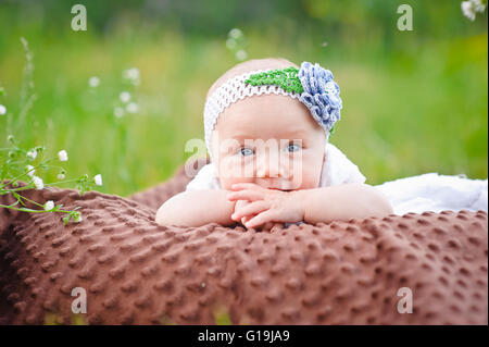 Newborn baby girl in park Stock Photo