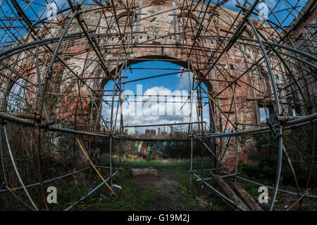 Lots of scaffolding supporting structure inside Abandoned building Stock Photo