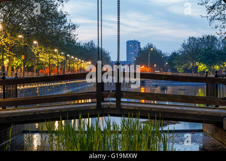 Wooden path bridge over London Albion Channel linking to Surrey Water Stock Photo