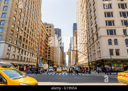 NEW YORK, USA - APRIL 21, 2016: Unidentified people on the Times Square, New York. Times Square is the most popular tourist loca Stock Photo