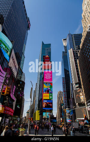 NEW YORK, USA - MAY 7, 2016: Unidentified people on the Times Square, New York. Times Square is the most popular tourist locatio Stock Photo