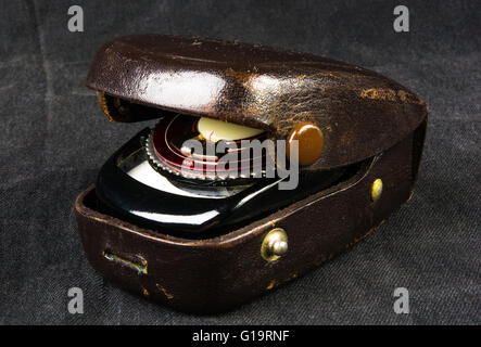 old vintage Soviet exposure meter with leather case on black background Stock Photo