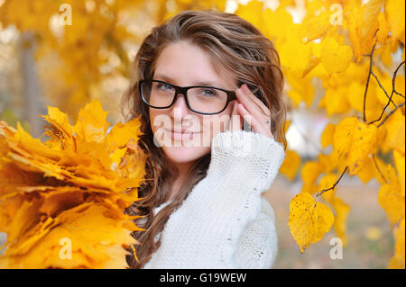 beautiful girl with glasses in autumn Stock Photo