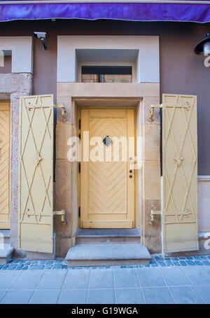 Yellow front door in Vintage street