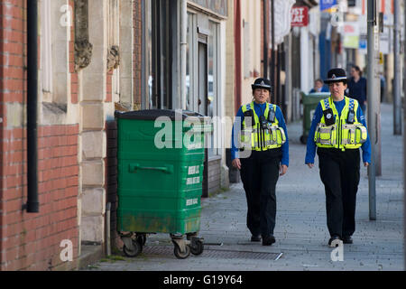 Female police officers on patrol in Maesteg, south Wales.
