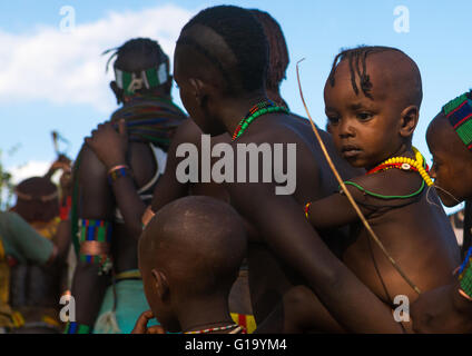 Hamer tribe children attending a bull jumping ceremony, Omo valley, Turmi, Ethiopia Stock Photo