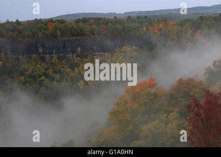 clouds in hills fall colors trees John Boyd Thacher State Park Albany, New York Stock Photo