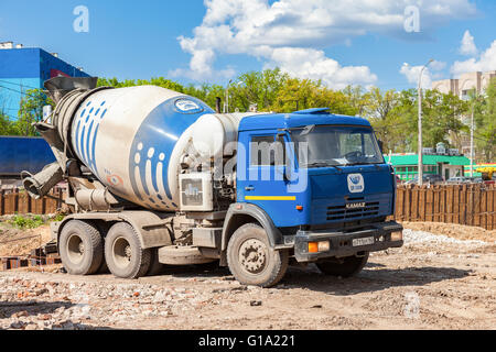 Concrete mixer truck KAMAZ at the construction of road Stock Photo