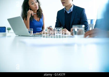 Asian business partners having meeting in office Stock Photo
